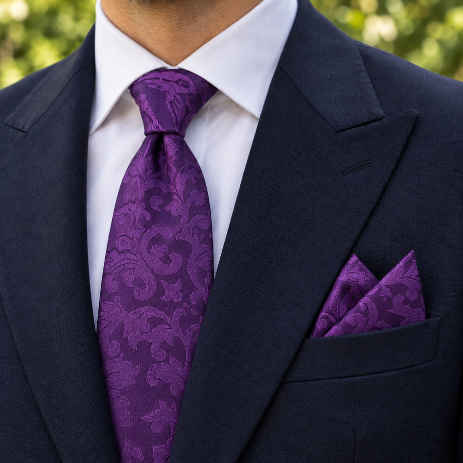 Amethyst Scroll Damask silk tie and matching pocket square — Navy peak lapel · pointed fold