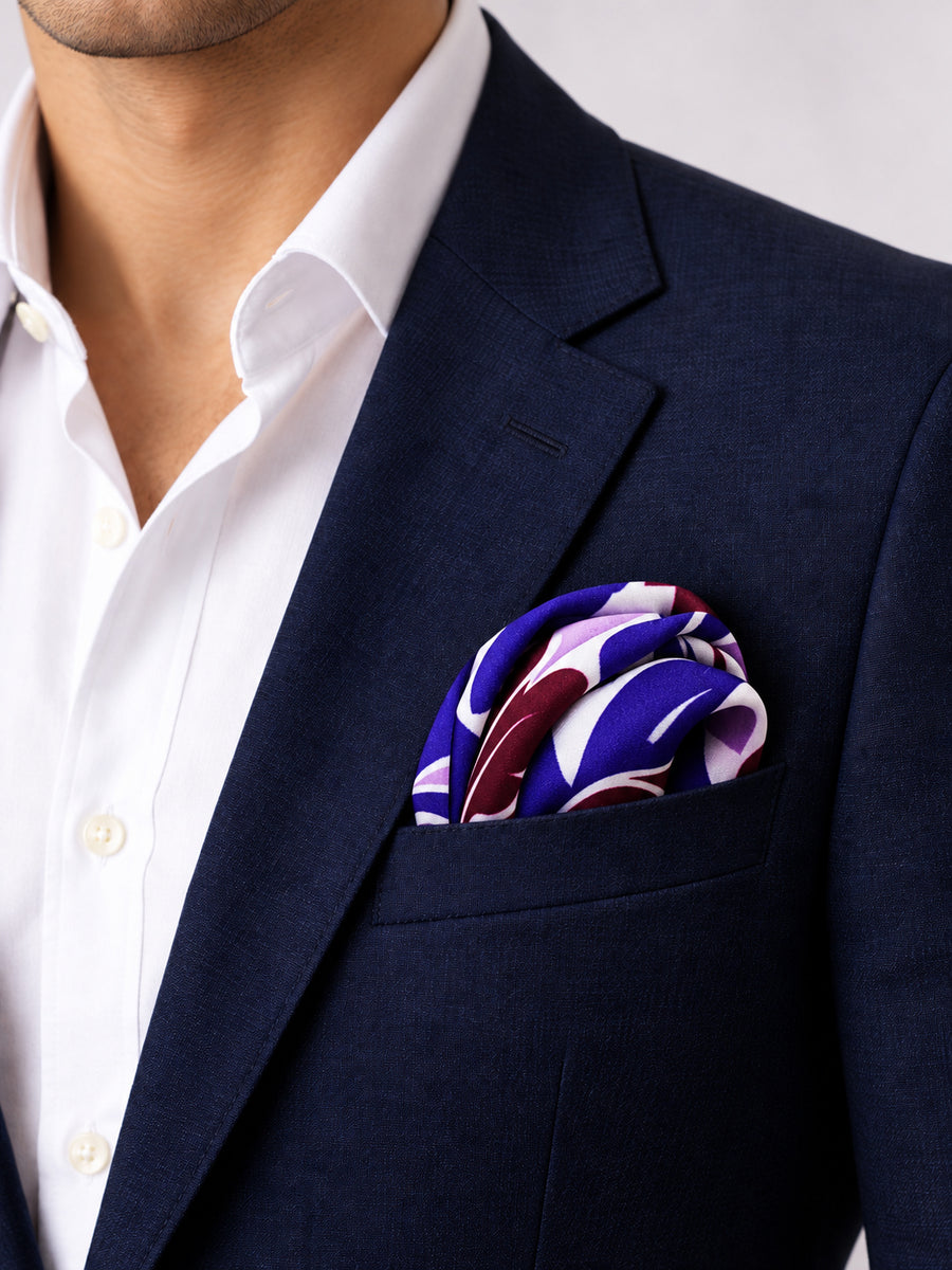 Antique Abstract pocket square with purple, lavender and burgundy acanthus print on white — navy jacket · rounded puff.