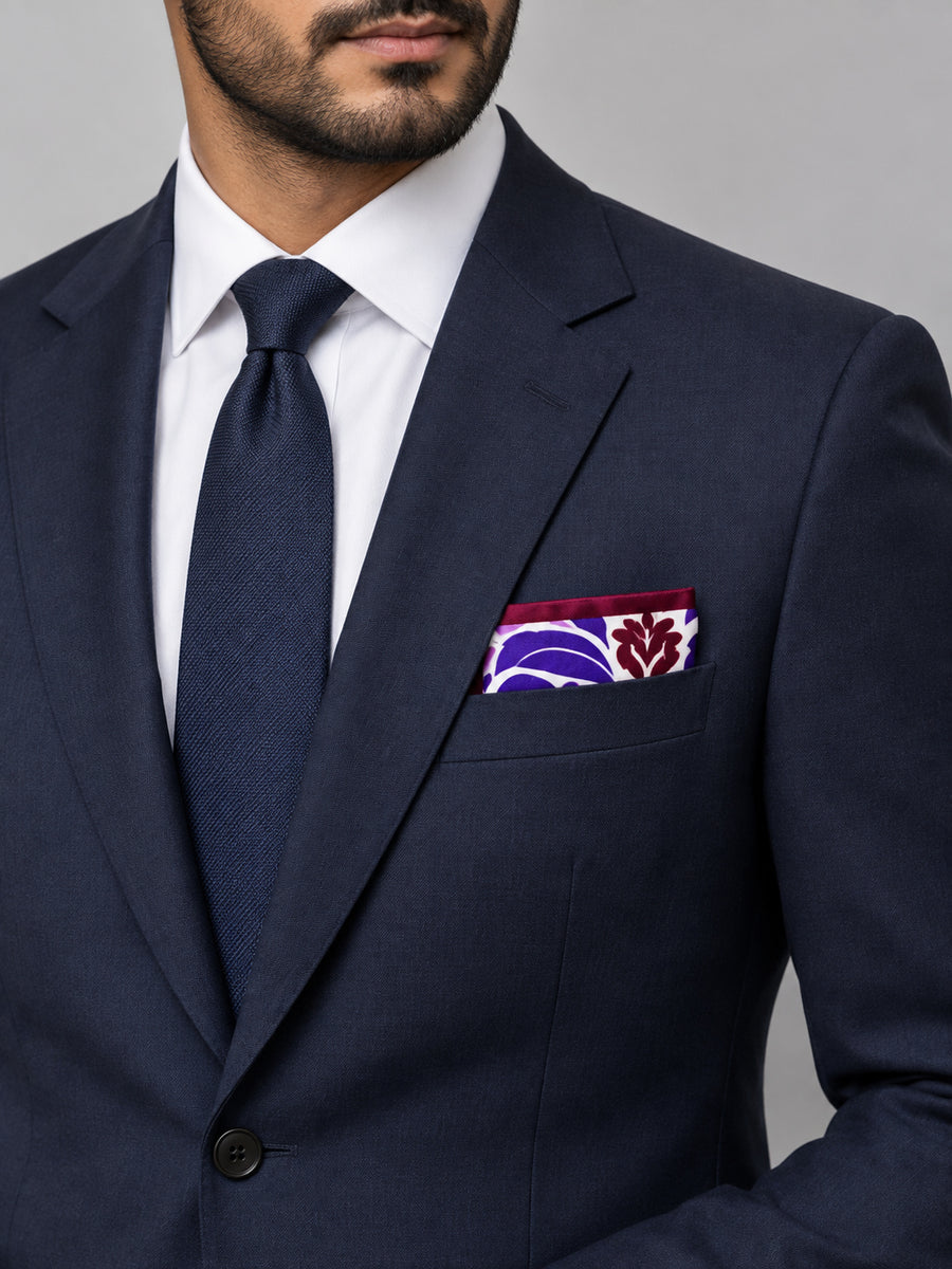 Antique Abstract pocket square with purple, lavender and burgundy acanthus print on white — formal model · navy and tie.