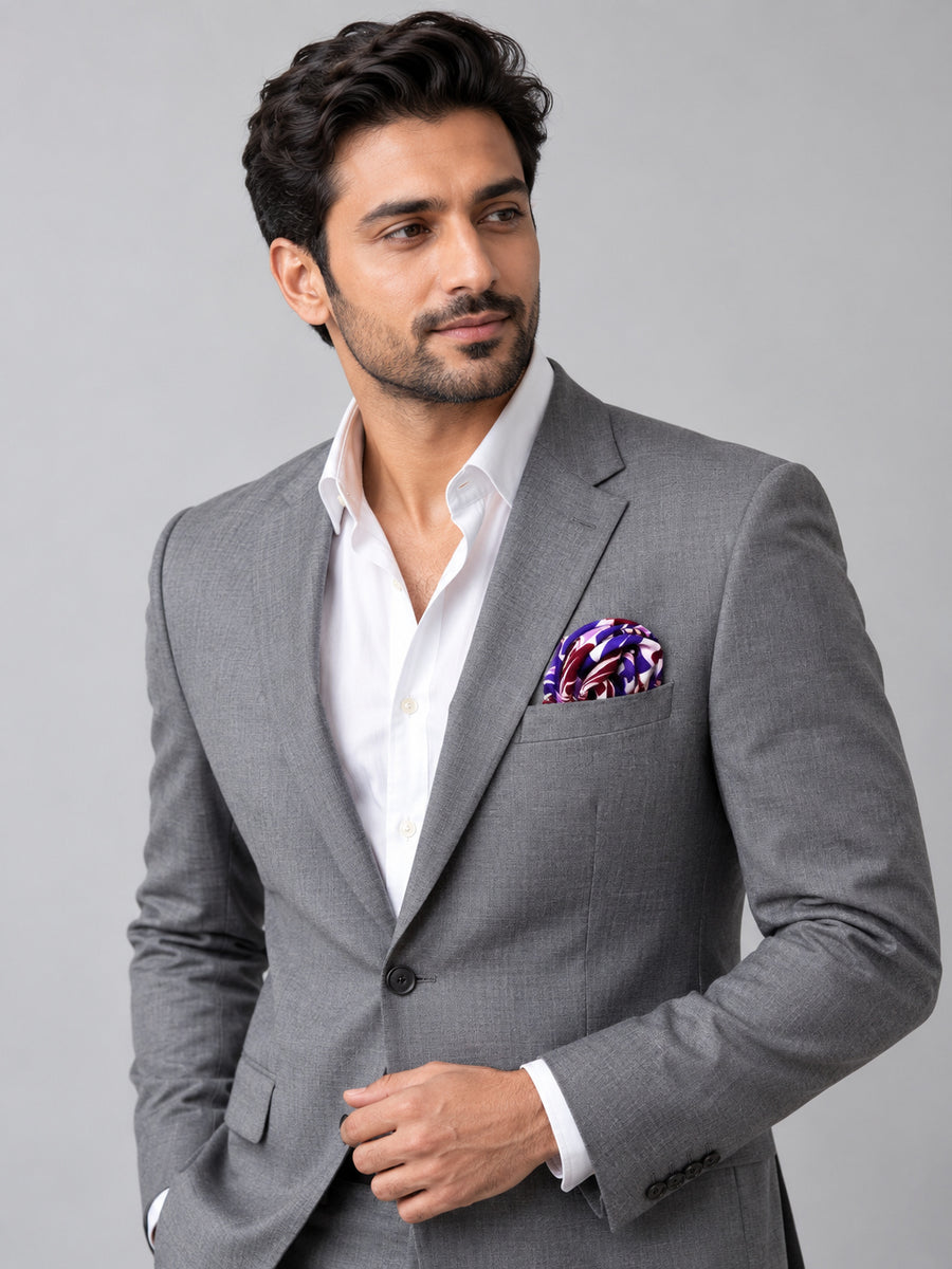 Antique Abstract pocket square with purple, lavender and burgundy acanthus print on white — model · light grey and open collar.