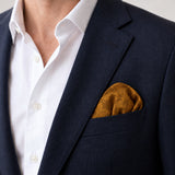 Antique Gold Scroll Damask Silk Pocket Square — Navy jacket · rounded puff
