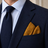 Antique Gold Scroll Damask Silk Pocket Square — Navy jacket · pointed fold