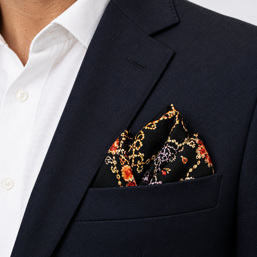 Ball Chain Art pocket square — navy jacket · alternate fold.