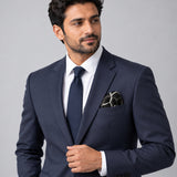 Black and White Hexagonal pocket square — formal model · navy and tie.