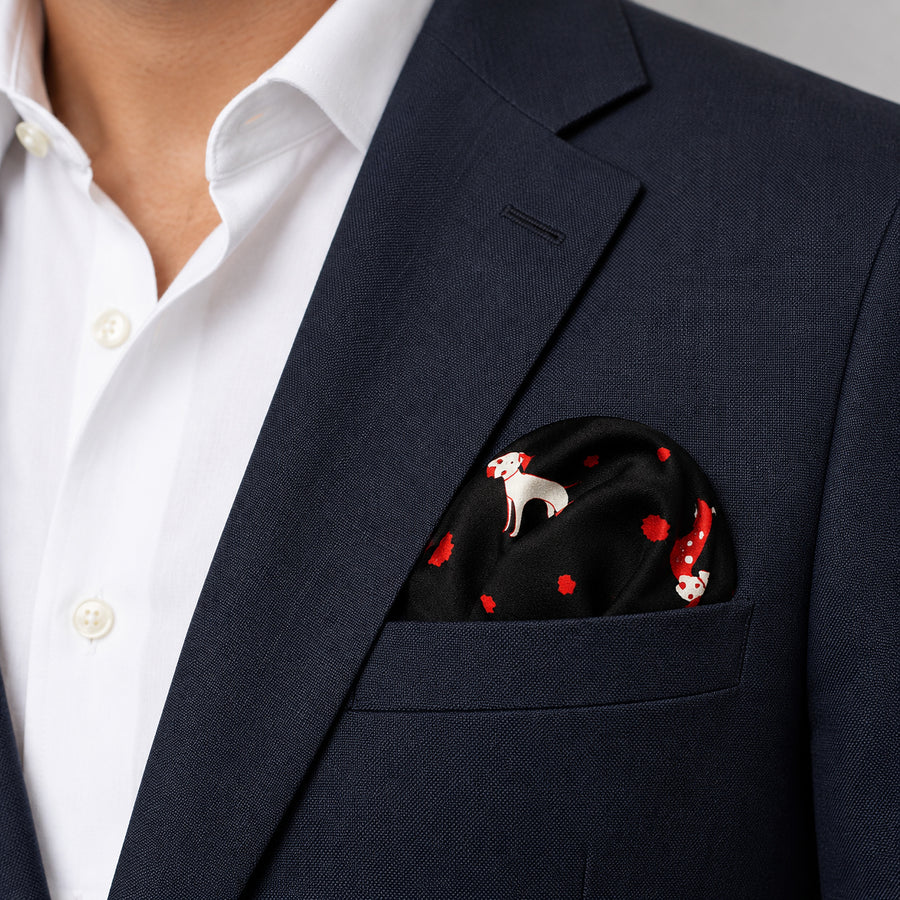 Black Dalmatian pocket square — navy jacket · wearing detail.