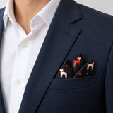 Black Dalmatian pocket square — navy jacket · alternate fold.