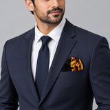 Black & Gold Chain Pattern pocket square — formal model · navy and tie.