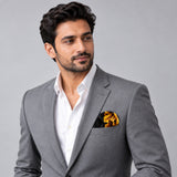 Black & Gold Chain Pattern pocket square — model · light grey and open collar.