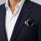 Black & White Abstract pocket square — navy jacket · wearing detail.