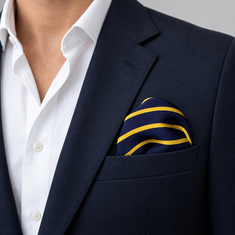 Blue and Gold Stripes pocket square — navy jacket · wearing detail.