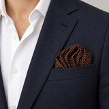 Brown Dot Polka pocket square — navy jacket · wearing detail.