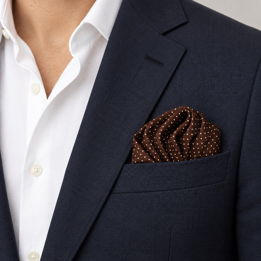 Brown Dot Polka pocket square — navy jacket · wearing detail.