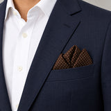 Brown Dot Polka pocket square — navy jacket · alternate fold.