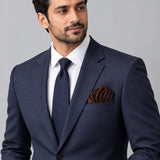 Brown Dot Polka pocket square — formal model · navy and tie.