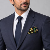 Chain Loop Green pocket square — formal model · navy and tie.