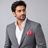 Chains and Straps (Pink) pocket square — model · light grey and open collar.