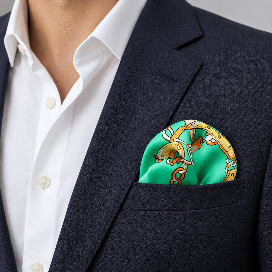 Chains and Straps (Sea Green) pocket square — navy jacket · wearing detail.