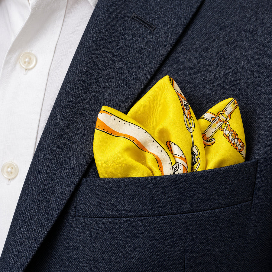 Chains and Straps (yellow) pocket square — navy jacket · alternate fold.