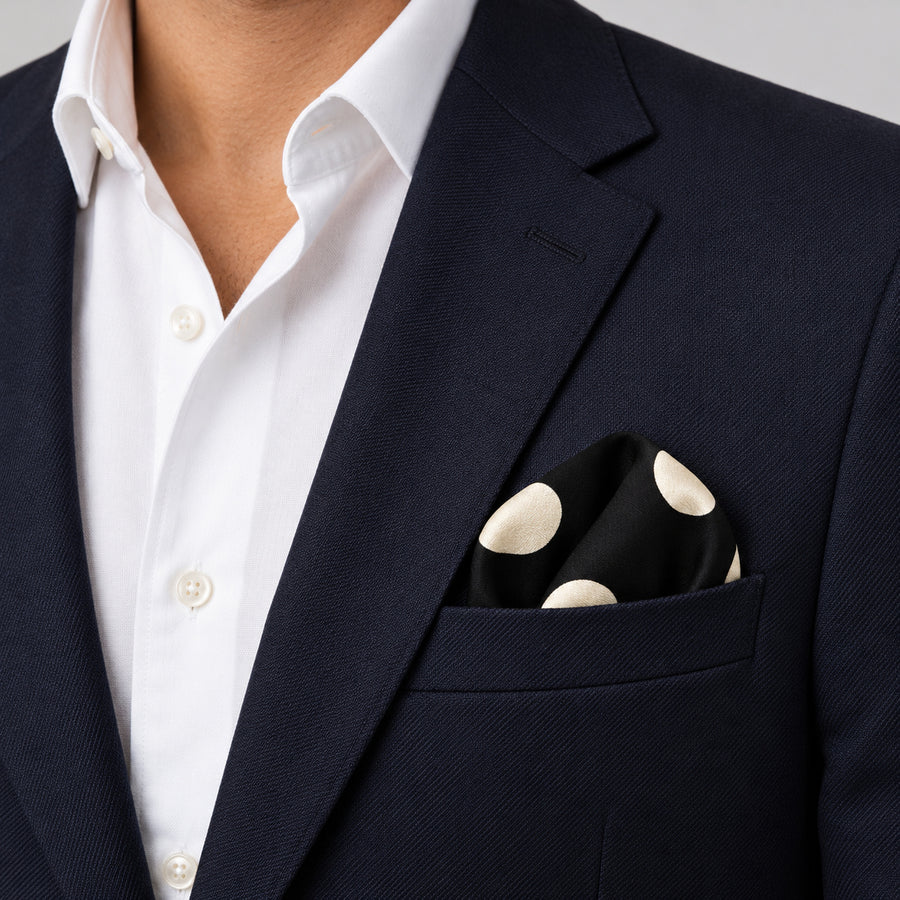 Black and White Jumbo Polka Dots pocket square — navy jacket · wearing detail.