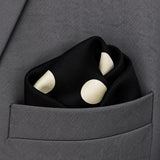Black and White Jumbo Polka Dots pocket square — close-up wearing detail.