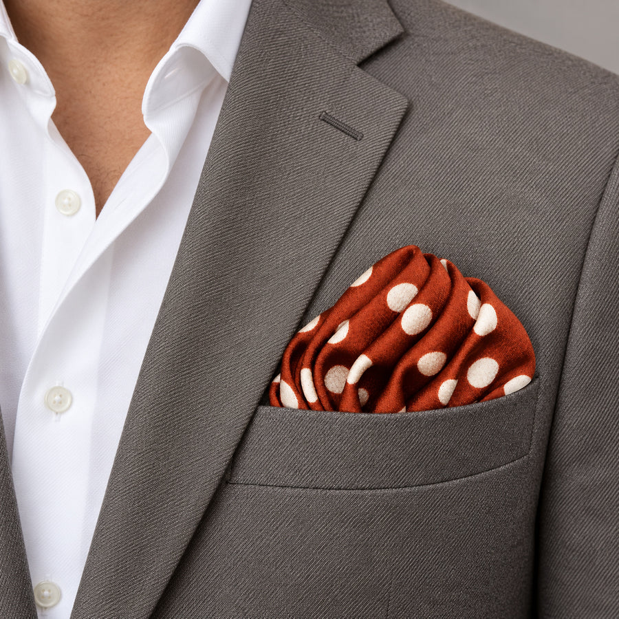 Copper Base Polka Dots pocket square — light jacket · wearing detail.