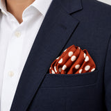Copper Base Polka Dots pocket square — navy jacket · alternate fold.