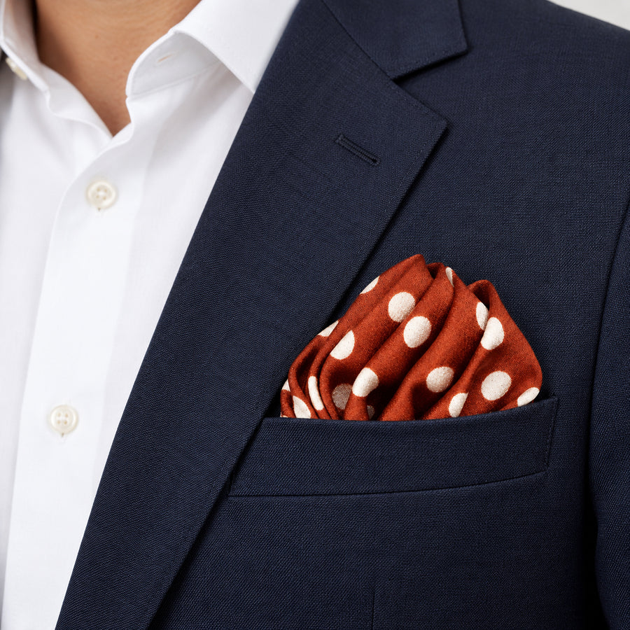 Copper Base Polka Dots pocket square — navy jacket · alternate fold.
