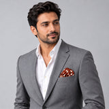 Copper Base Polka Dots pocket square — model · light grey and open collar.