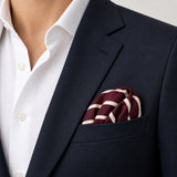 Creamy Rosewood Stripes pocket square — navy jacket · wearing detail.