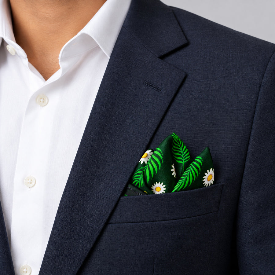 Green Floret pocket square — navy jacket · alternate fold.