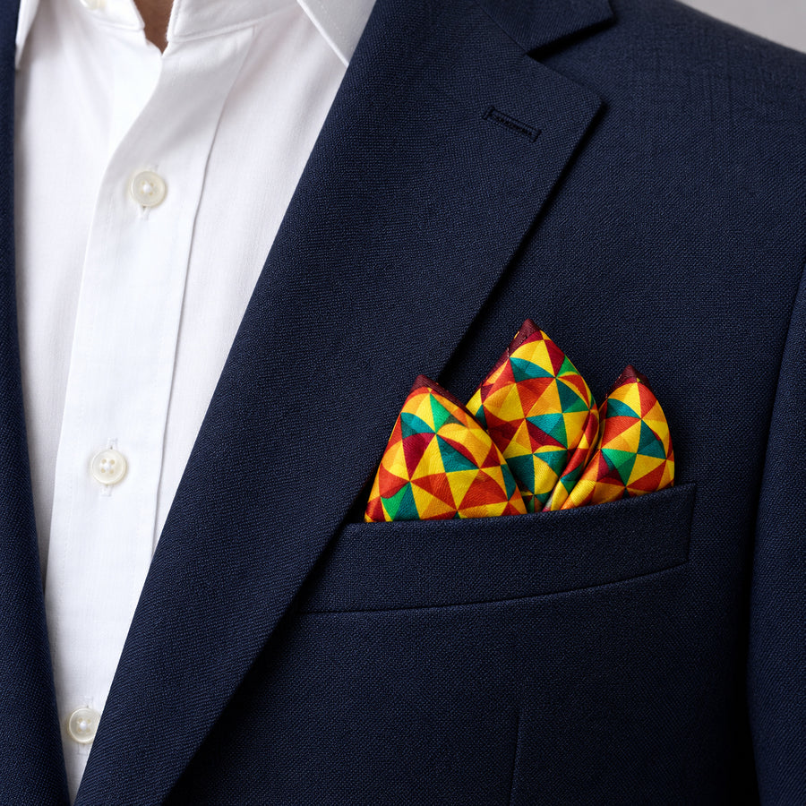 Geometric Art pocket square — navy jacket · alternate fold.