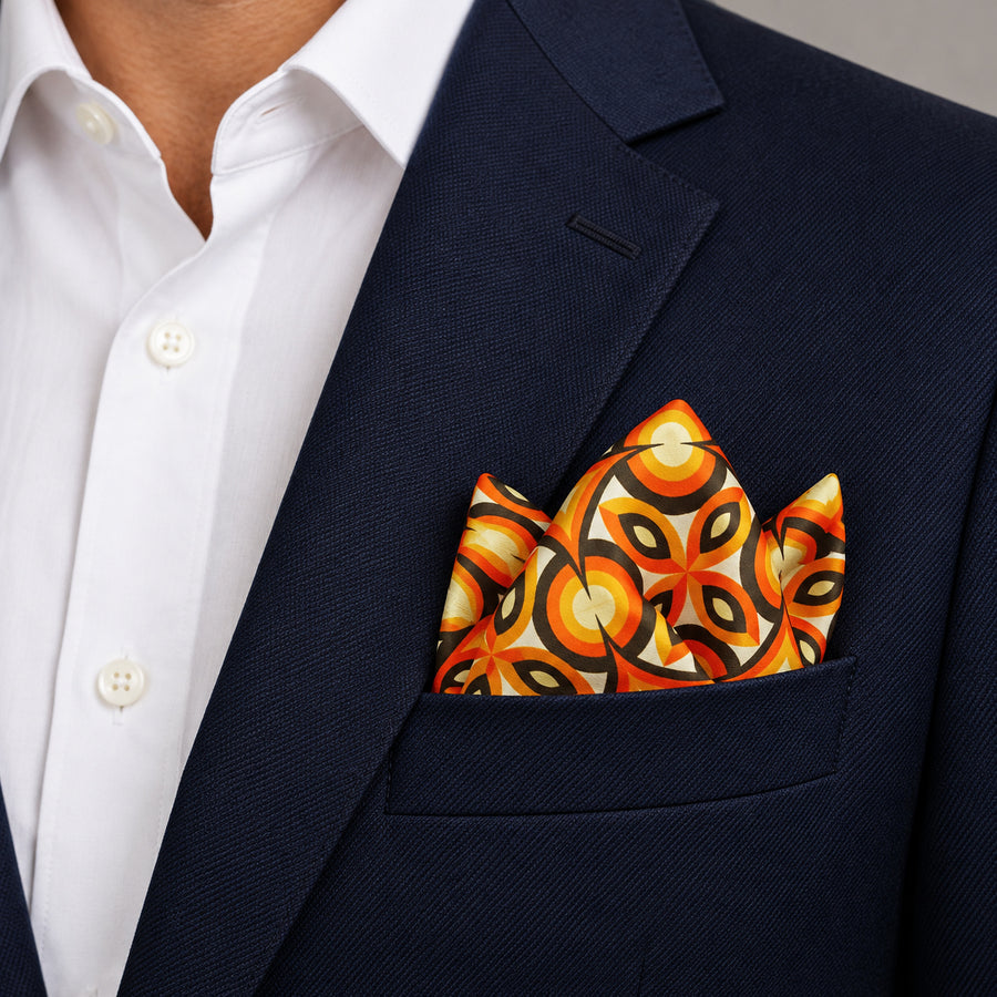 Geometric Repeat Pattern pocket square — navy jacket · alternate fold.