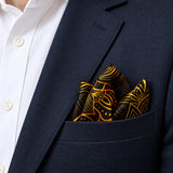 Gold Ornamental pocket square — navy jacket · alternate fold.