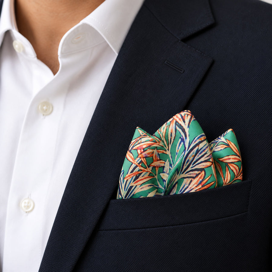 In The Jungle pocket square — navy jacket · alternate fold.