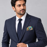 In The Jungle pocket square — formal model · navy and tie.