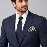 Infinite Geometric Loop pocket square — formal model · navy and tie.