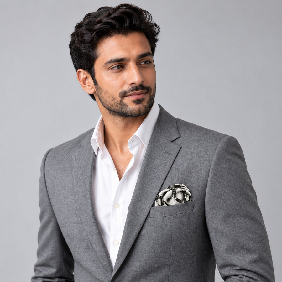 Infinite Geometric Loop pocket square — model · light grey and open collar.