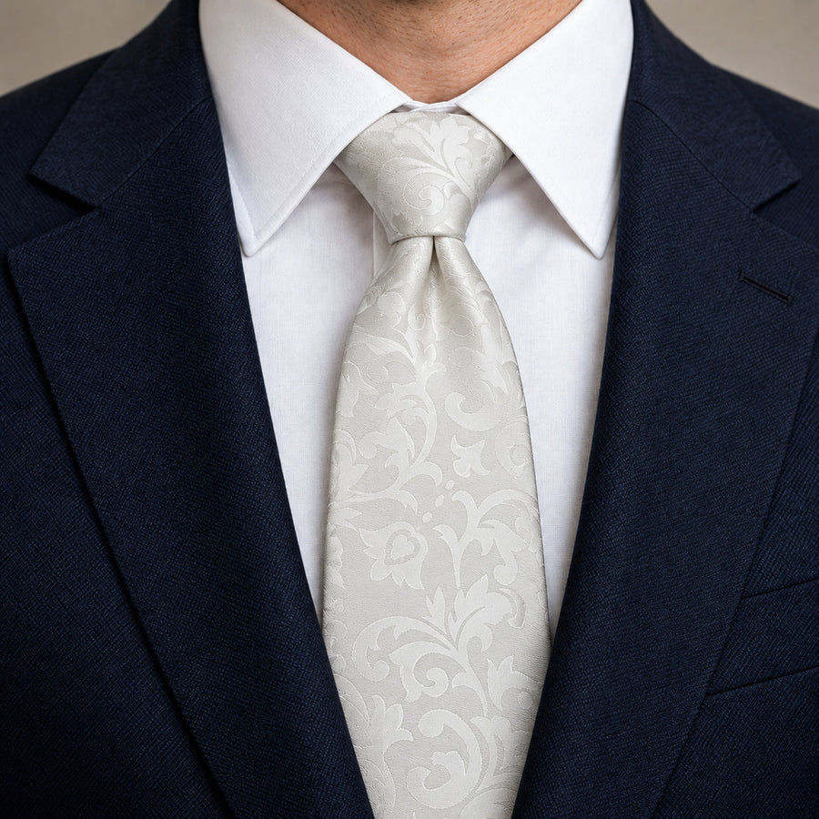 Ivory Scroll Damask Silk Tie — Knot and lapel close-up