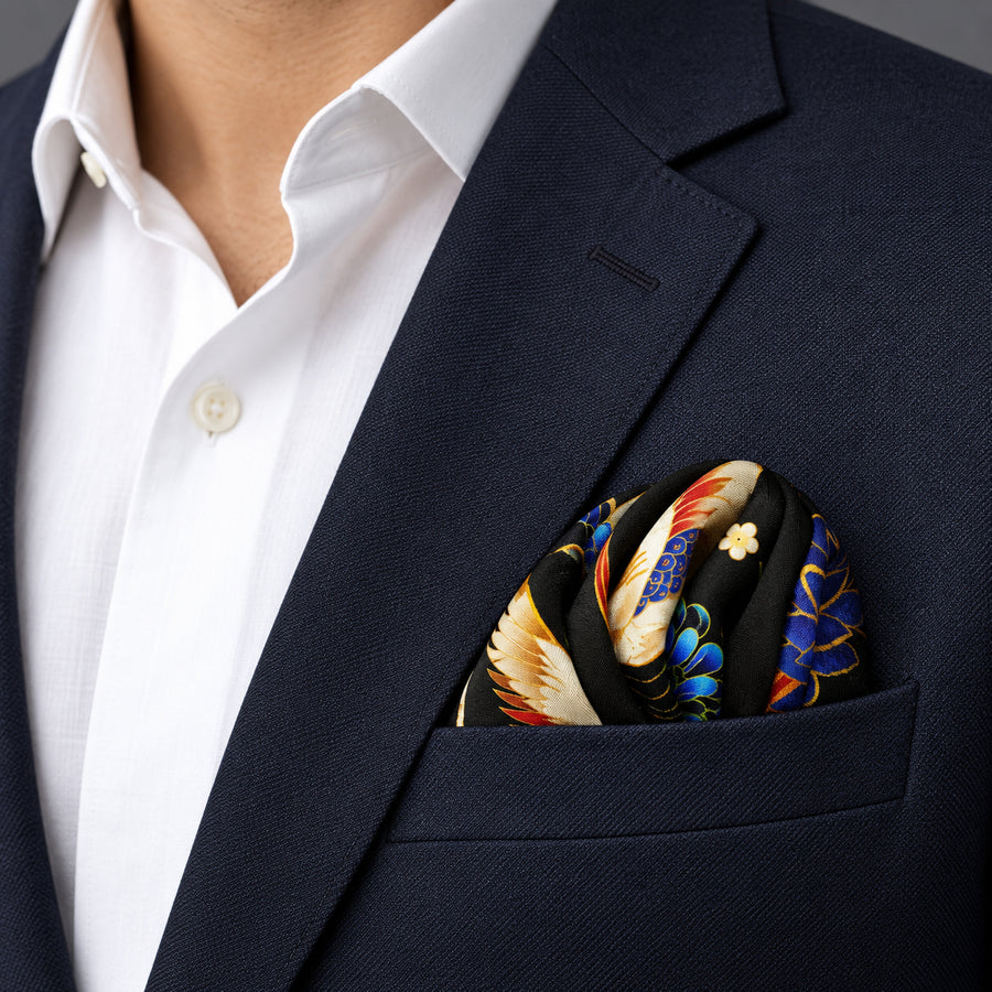 Mandarin Heron Black pocket square — navy jacket · wearing detail.
