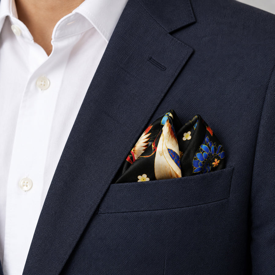 Mandarin Heron Black pocket square — navy jacket · alternate fold.