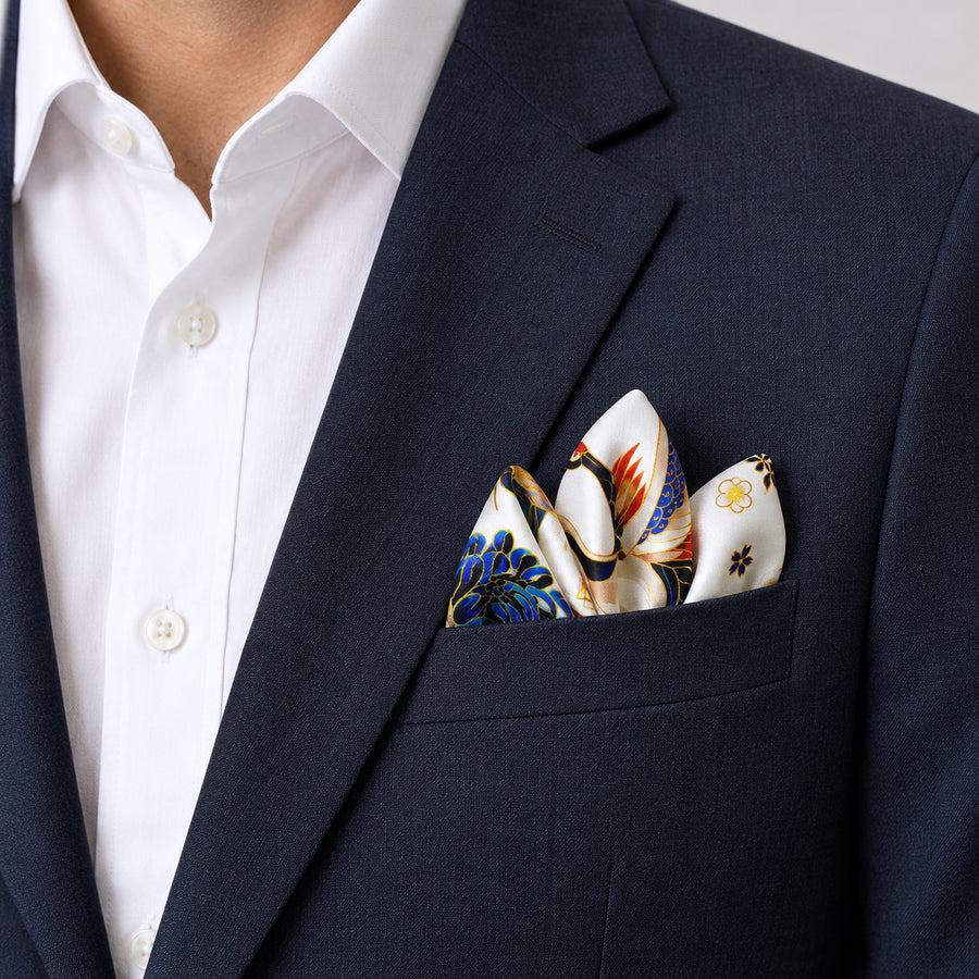 Mandarin Heron White pocket square — navy jacket · alternate fold.