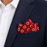 Maroon and Gold Reversible pocket square — navy jacket · alternate fold.