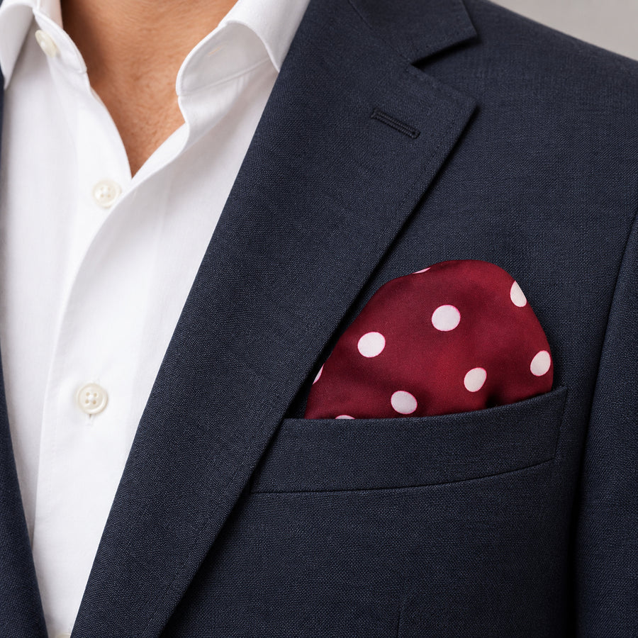 Maroon and White Polka Dots pocket square — navy jacket · wearing detail.
