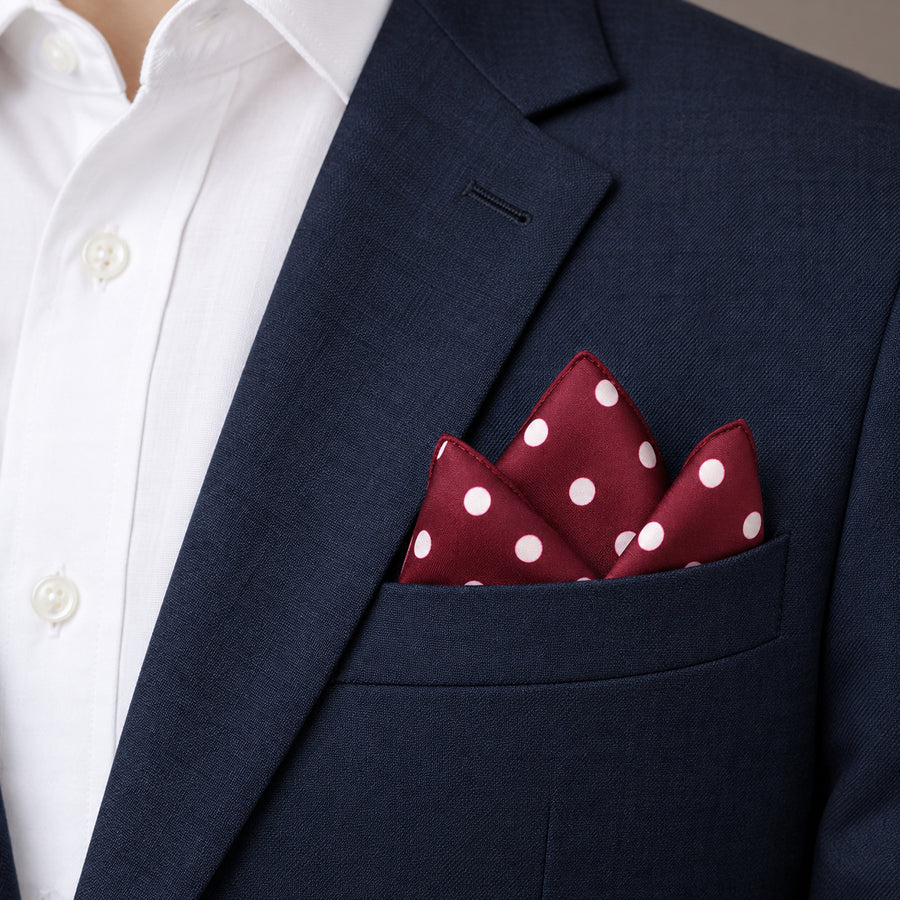 Maroon and White Polka Dots pocket square — navy jacket · alternate fold.