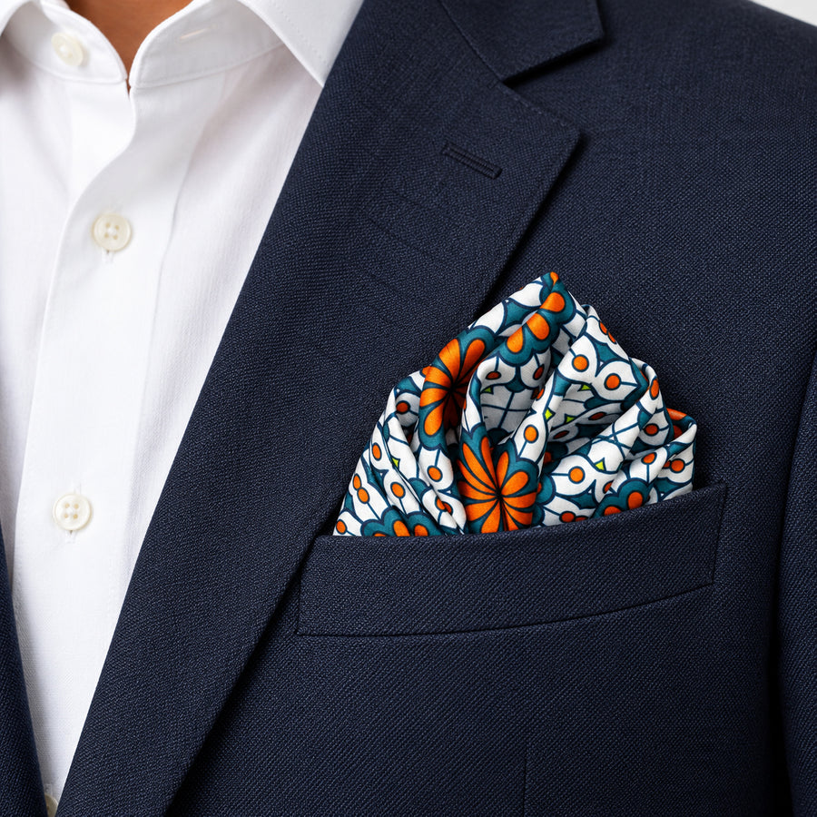 Mexican Floral Loop pocket square — navy jacket · alternate fold.