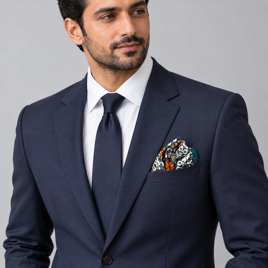 Mexican Floral Loop pocket square — formal model · navy and tie.