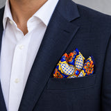 Mexican Talavera pocket square — navy jacket · alternate fold.