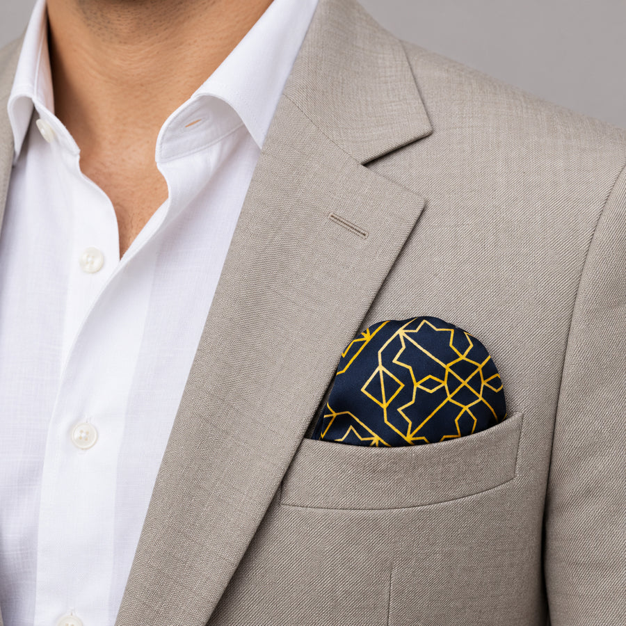 Navy and Gold Rugs pocket square — light jacket · wearing detail.