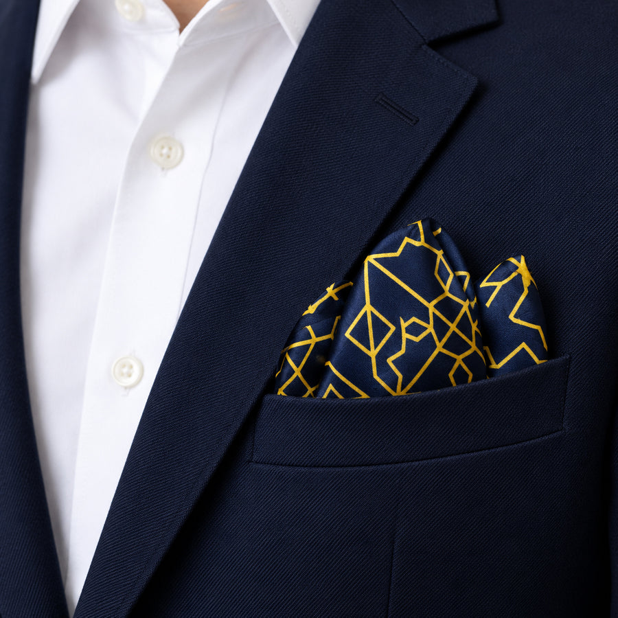 Navy and Gold Rugs pocket square — navy jacket · alternate fold.