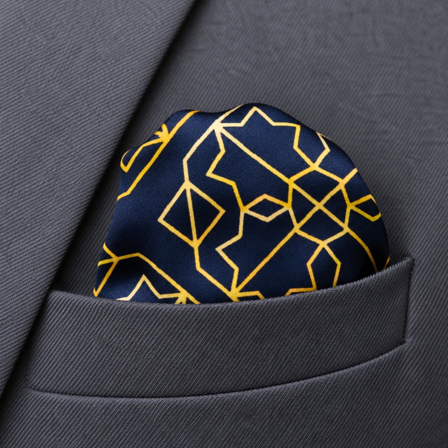 Navy and Gold Rugs pocket square — close-up wearing detail.